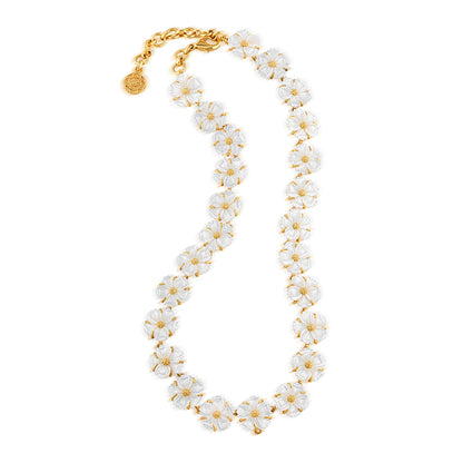 The Juliska Capucine De Wulf Mermaid Garden Petite Riviere Convertible Necklace features hand-carved detailing and white floral beads with gold accents, arranged in a single strand for a daisy chain effect.