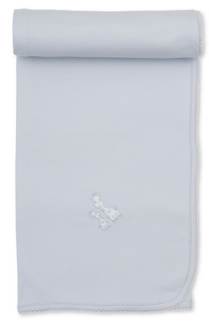 Giraffe Laughs Blanket by Kissy Kissy in light blue Pima cotton features scalloped edges, is rolled at the top, and showcases two embroidered blue puppies near the center.