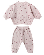 Cozy up in the Quincy Mae Baby Girls' and Girls' Waffle Slouch Set—a pink, long sleeve top and matching pants with maroon heart patterns. The waffle-knit set features a front pocket and ribbed cuffs for comfort.