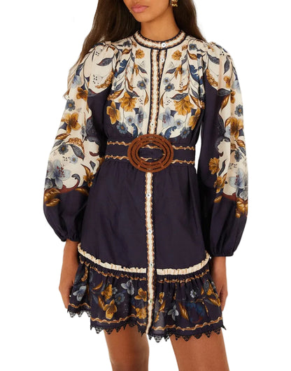 Farm Rio Golden Nature Belted Mini Dress in navy blue, cream, and yellow botanical print with long puff sleeves, a button-down front, and a circular buckle belt.