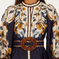Farm Rio Golden Nature Belted Mini Dress, a long-sleeved floral mini dress in cream and navy, featuring a button-down front and a circular brown rope belt at the waist.