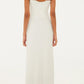A woman facing away, wearing the Farm Rio Palm Tree Knit Off White Midi Dress with crochet hem detail, paired with sandals and large round earrings against a plain light background.