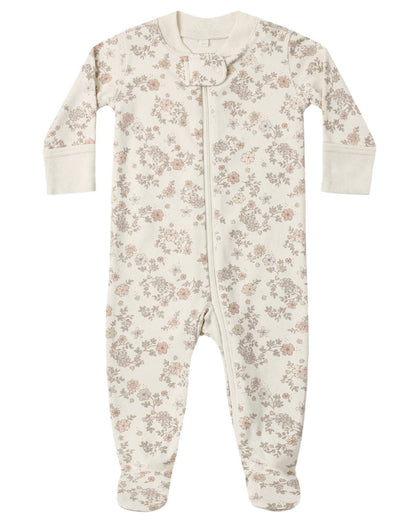 The Quincy Mae Baby Zip Long Sleeve Sleeper Footie is made from soft organic brushed jersey and features a white base adorned with an all-over beige floral pattern. Designed for convenience, this baby footie includes a front zipper closure for easy changes.