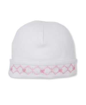 Kissy Kissy Baby Girls’ CLB Summer Bows Hat with a folded brim, made from soft Pima cotton and embellished with delicate pink embroidered diamond and flower motifs, is displayed on a plain white background. Part of the CLB Summer Bows 26 Collection, this charming piece showcases exquisite hand embroidery for an elegant finishing touch.