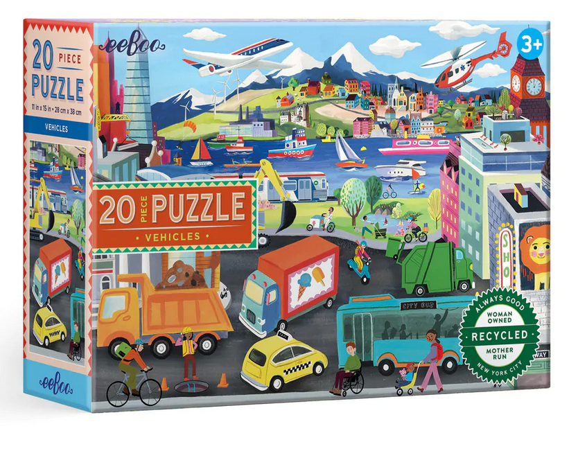 The eeboo Vehicles 20 Piece Puzzle by Eeboo showcases a vibrant cityscape filled with colorful illustrations of various vehicles, people, and activities. Ideal for children ages 3 and up, it helps develop hand-eye coordination and is crafted from recycled materials.