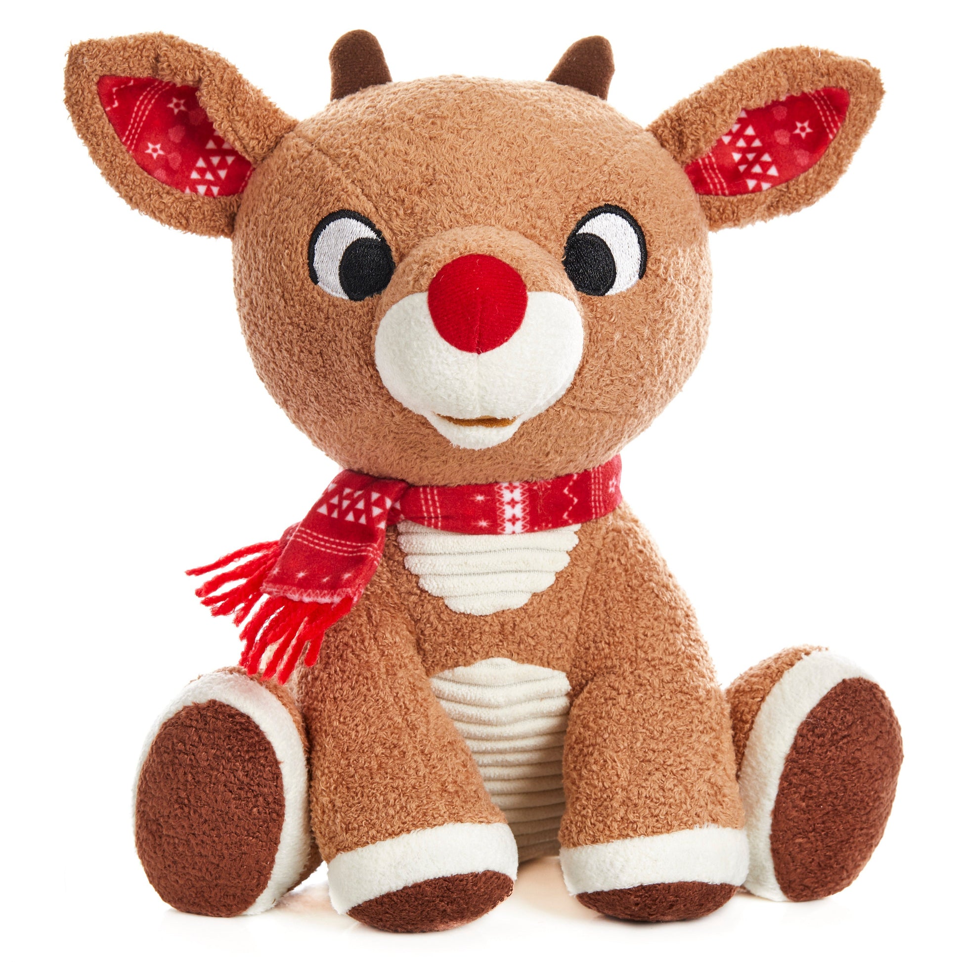 The Kids Preferred Rudolph Plush features a red nose, red patterned scarf, and inner ears. Sitting upright against a white background, this festive Christmas toy is perfect for the holiday season.