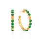 The Berry Gem Medium Hoop Earrings by Juliska Capucine De Wulf feature gold hoops with green gemstone accents and clustered gems, accented by delicate gold beads. Shown from front and side views on a white background.