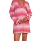 Person wearing a lemlem Raey Dress by Lemlem in hand-woven in Ethiopia pink and white striped long-sleeve V-neck style.