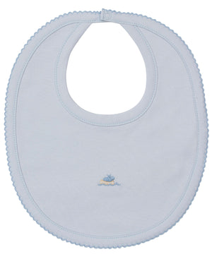 Kissy Kissy's Premier Noah's Ark Bib with Hand Emb. is a light blue Pima cotton bib featuring scalloped edges, a neck snap closure, and an embroidered whale and wave design at the center.