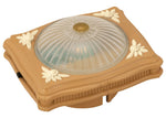 The Calico Critters Ceiling Light is a rectangular plastic fixture featuring a ribbed, dome-shaped glass cover and charming floral accents on each corner—an ideal accessory to illuminate your dollhouse décor or add a perfect finishing touch as a ceiling light for your Calico Critters home.