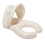 The SUNNYLIFE "Strawberry Sunshine Float Together Baby Seat" is an inflatable baby pool float with a built-in shade, designed in a light cream color and adorned with a small pink fruit pattern. This stylish swim seat provides comfort and protection for your little one as they enjoy the water.
