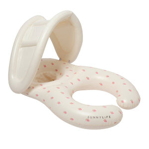 The SUNNYLIFE "Strawberry Sunshine Float Together Baby Seat" is an inflatable baby pool float with a built-in shade, designed in a light cream color and adorned with a small pink fruit pattern. This stylish swim seat provides comfort and protection for your little one as they enjoy the water.