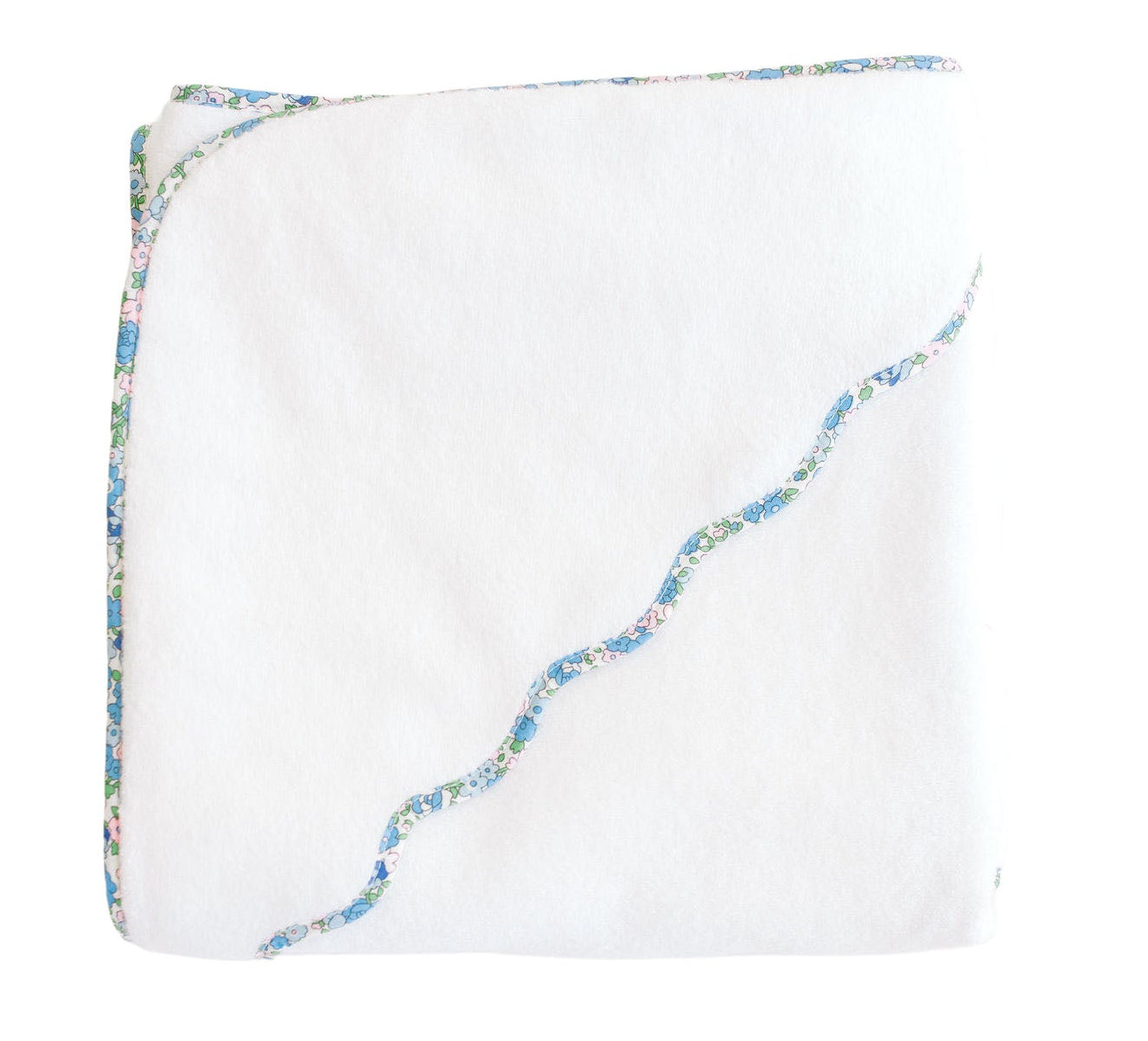 The Terry Tots Kids’ Scalloped Hooded Towel features a folded white design with a blue and pink floral trim and a wavy embroidered edge, making it an essential nursery accessory or baby towel, shown isolated on a white background.