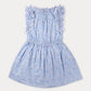 Girls’ Florence Dress by Early Sunday in light blue Swiss Dobby fabric, showcasing a tonal floral blue print, ruffled shoulders, white lace trim, gathered waist, and flared skirt, laid flat on a plain white background.