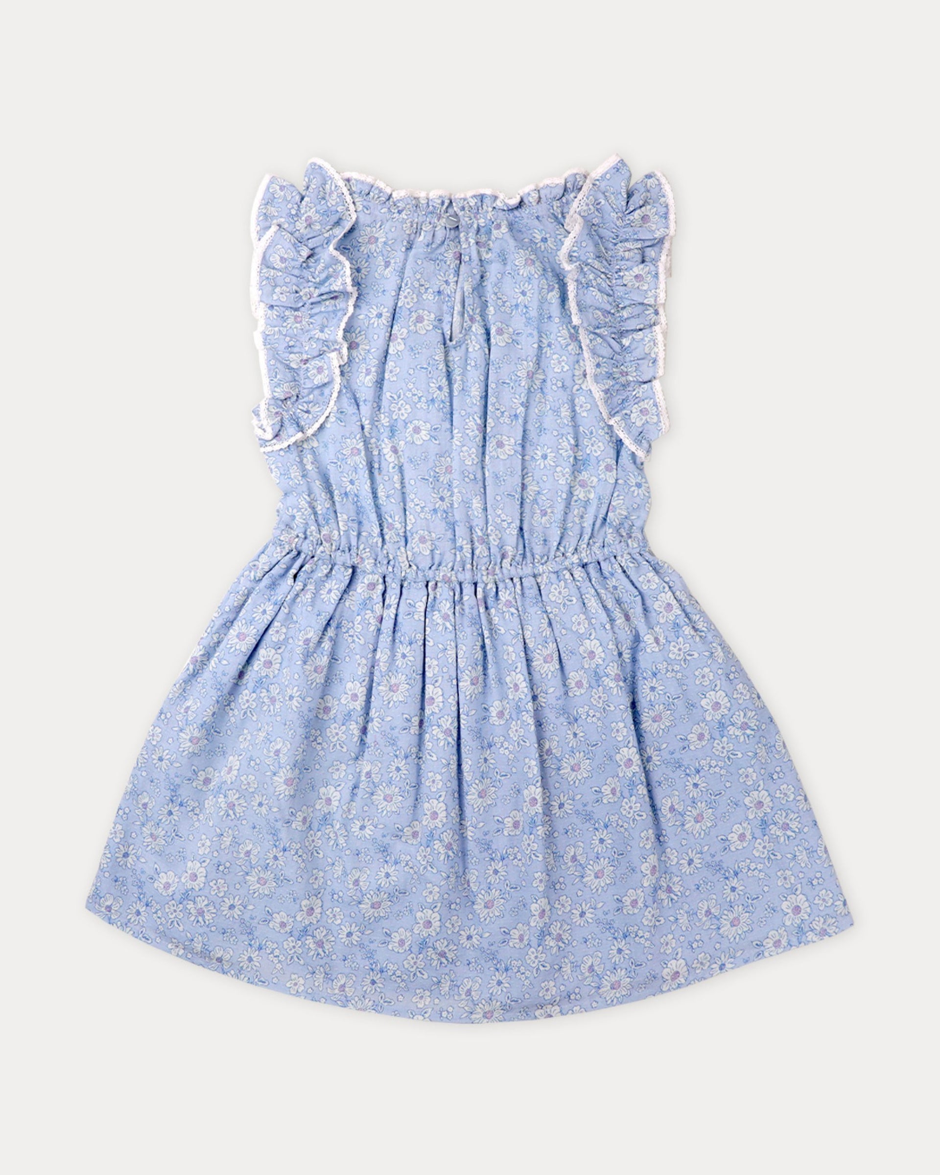Girls’ Florence Dress by Early Sunday in light blue Swiss Dobby fabric, showcasing a tonal floral blue print, ruffled shoulders, white lace trim, gathered waist, and flared skirt, laid flat on a plain white background.