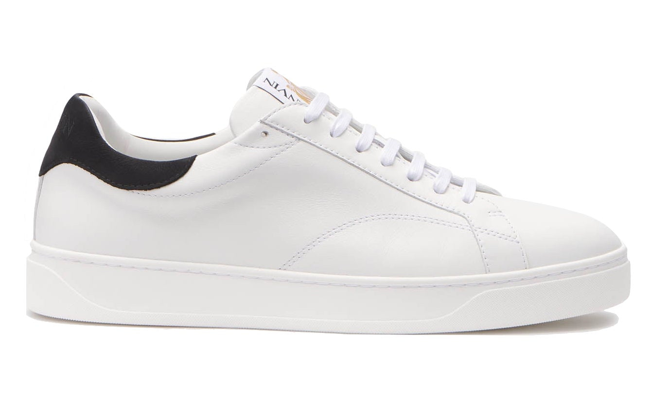 The Lanvin DDB0 Sneakers, crafted from smooth calfskin, feature a black heel tab adorned with the Lanvin logo, complemented by white laces and a sleek white sole.