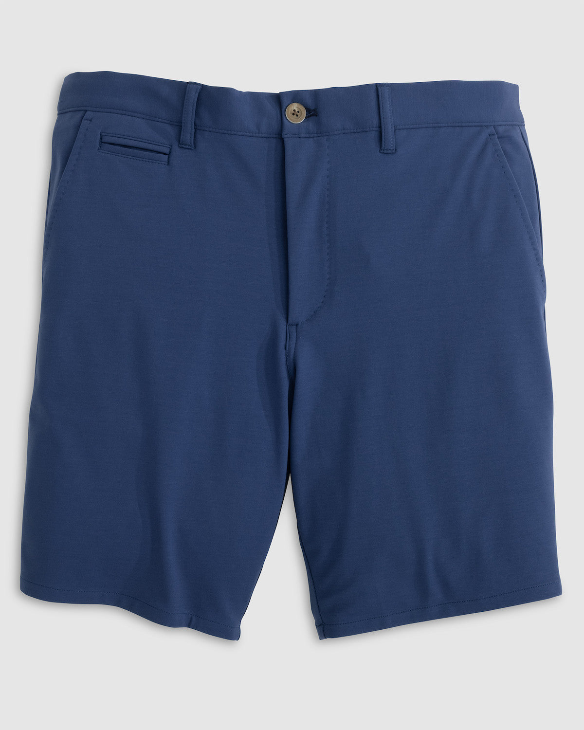 The Jupiters Short by Johnnie-O is a pair of blue men's golf shorts made from technical performance cotton, with a button closure, belt loops, front pockets, and a single welt pocket on the right side.