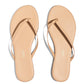 A pair of Lily Nudes sandals from the Tkees collection.