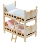 Calico Critters Stack and Play Beds—a charming miniature wooden bunk bed with a ladder, featuring a blue pillow and blanket on the top bunk and a pink pillow and blanket on the bottom—perfect as adorable dollhouse furniture or to expand your Calico Critters collection.