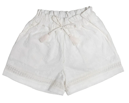 Early Sunday Girls’ Roman Shorts, crafted from breathable white cotton-linen with an elastic waistband, drawstring tie, tassel details, and lace trim near the hem, are displayed on a plain background.