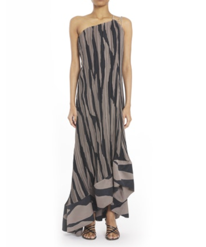 A person models the Lanvin Asymmetrical Cascade-Effect Dress—sleeveless, one-shoulder, black and beige zebra print with an integrated bustier and ruffled hem—stylishly paired with strappy sandals.