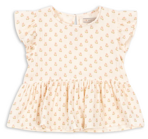 The Konges Slojd Baby Girls’ and Girls’ Coco Top features short ruffled sleeves and a charming floral print on cream-colored, breathable muslin, with a gathered waist that creates a sweet peplum silhouette and flared lower section.