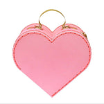 The Meri Meri Heart Suitcase in small, featuring a pink heart shape and glittery gold handles, is an ideal Valentine's Day gift.