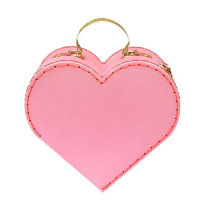 The Meri Meri Heart Suitcase in small, featuring a pink heart shape and glittery gold handles, is an ideal Valentine's Day gift.