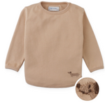 The Gingersnaps Baby Boys’ Teo Jersey Tee is a beige long-sleeve shirt in a city style, featuring a small embroidered dachshund near the hem; an inset highlights the charming embroidery detail.