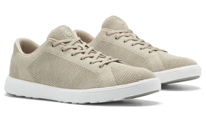 The Peter Millar Drift V2 Sneaker, designed in a beige mesh with anatomically crafted outsoles, white soles and laces, is displayed at an angle on a white background.