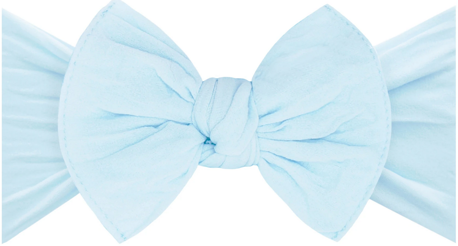 Introducing the Baby Bling Classic Knot Headband by Baby Bling, featuring a light blue fabric bow with a central knot, made from high-quality materials and boasting a slightly crinkled texture.