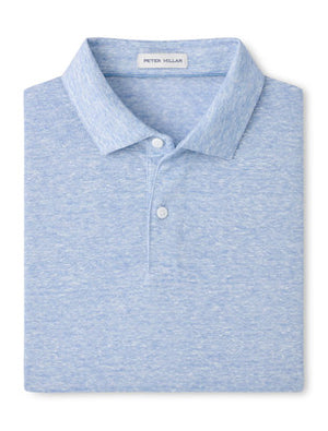 The Sanibel Polo by Peter Millar is a light blue heathered linen-cotton shirt with a collar and two white buttons—an effortless casual essential that elevates any wardrobe.