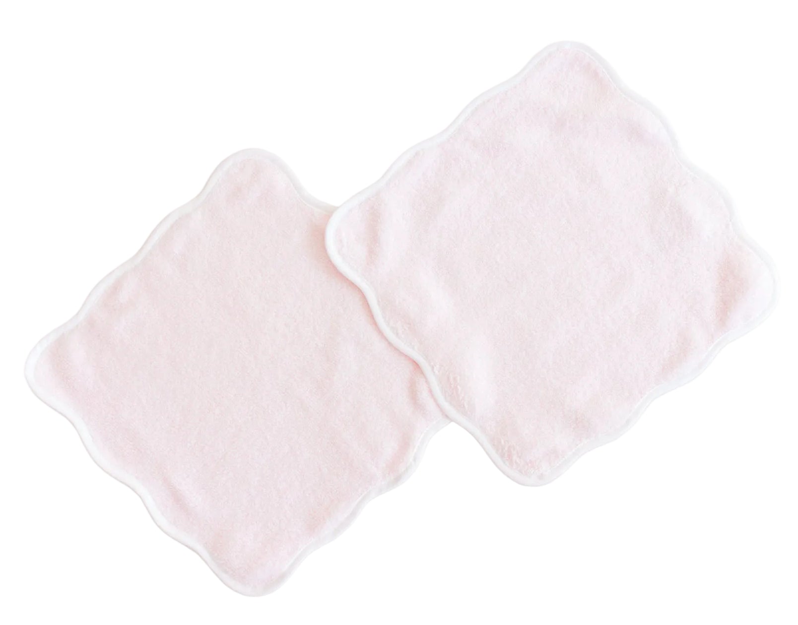 Two light pink, square-shaped plush wash cloths from the Terry Tots Wash Cloth Set, featuring scalloped edges and white trim, are shown overlapping each other on a white background. Perfect for gentle cleansing.