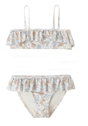 The Rylee & Cru Girls' Parker Bikini features delicate floral print on a light background, thin straps, and is made from UPF 50+ swimwear fabric for extra sun protection.