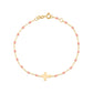 The Gigi Clozeau Little Gigi Classic Cross Charm Bracelet 5.1" features an 18k gold chain with pink resin pearls and a central gold cross charm, beautifully displayed on a white background.