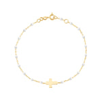 The Little Gigi Classic Cross Charm Bracelet 5.1" by Gigi Clozeau is crafted in 18k gold with small resin pearls along the chain and a flat cross charm at the center, finished with a spring ring clasp.