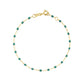 The Classic Gigi Bracelet 6.7" by Gigi Clozeau features 18k yellow gold and small green beads spaced along the chain, finished with a lobster clasp—ideal for daily wear.