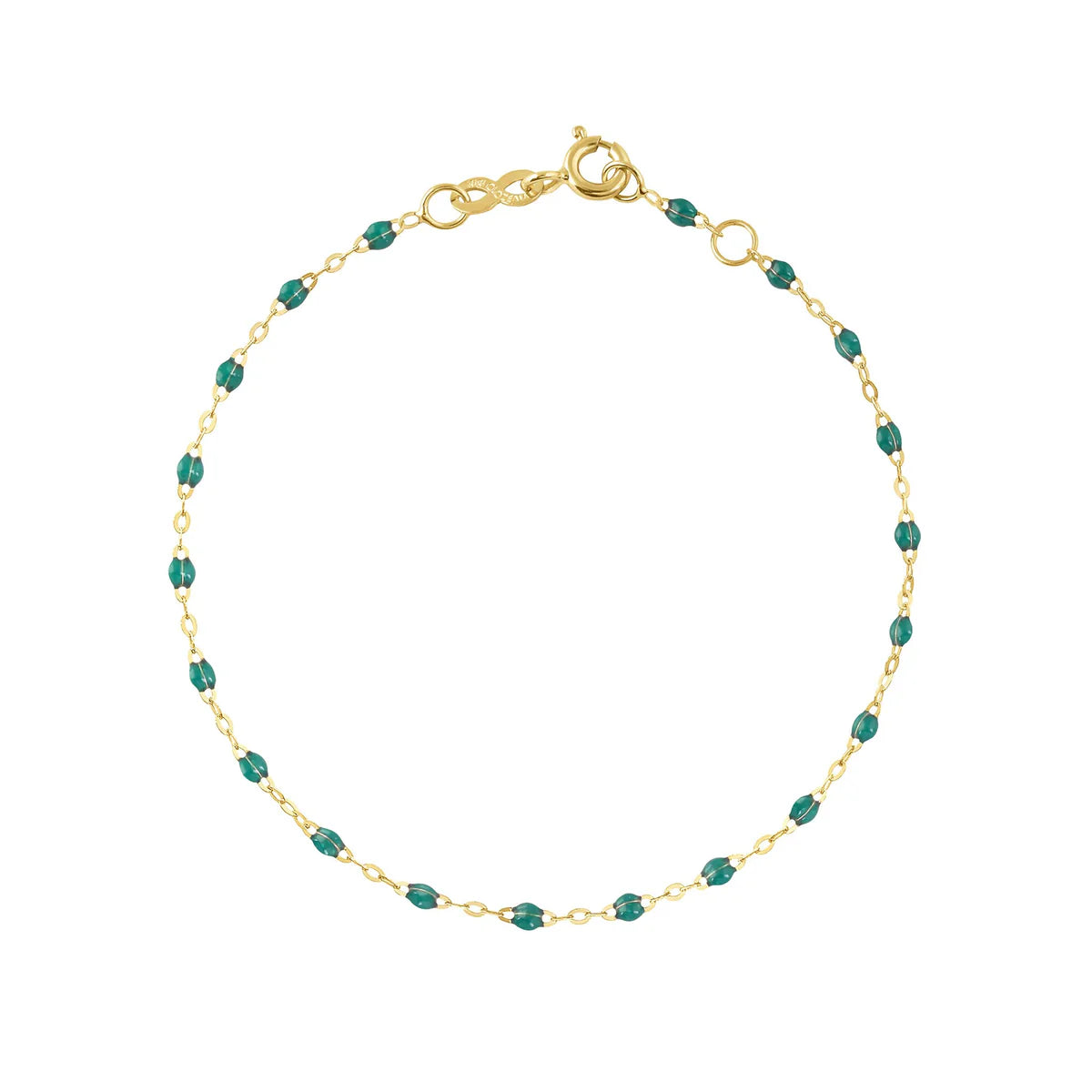 The Classic Gigi Bracelet 6.7" by Gigi Clozeau features 18k yellow gold and small green beads spaced along the chain, finished with a lobster clasp—ideal for daily wear.