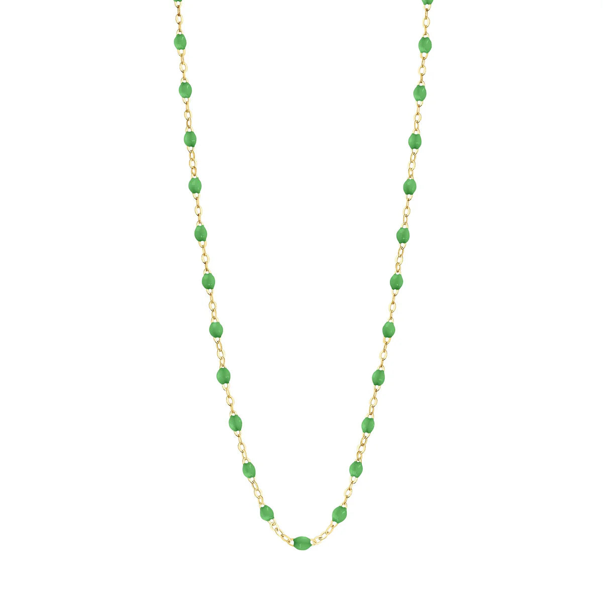 The Gigi Clozeau Classic Gigi Necklace, 16.5", is a stunning accessory that showcases a yellow gold chain adorned with striking jewels and evenly spaced green oval beads.