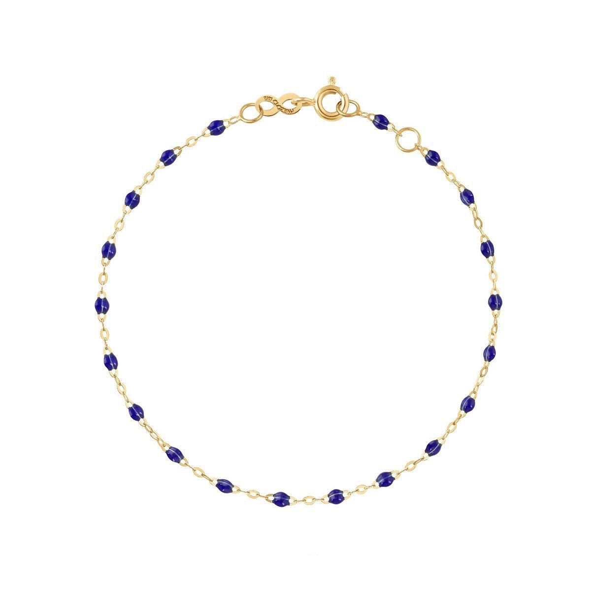 A Gigi Clozeau Classic Gigi Bracelet in 18-carat Yellow Gold with interspersed lapis lazuli beads displayed on a white background, labeled "lapis.