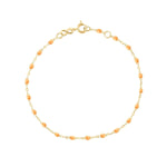 The Classic Gigi Bracelet 6.7" by Gigi Clozeau showcases timeless elegance with its 18-carat yellow gold and delicate orange beads.
