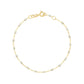 The Classic Gigi Bracelet 6.7" by Gigi Clozeau is crafted in 18K yellow gold with small white beads and a spring ring clasp—an elegant choice for everyday wear.
