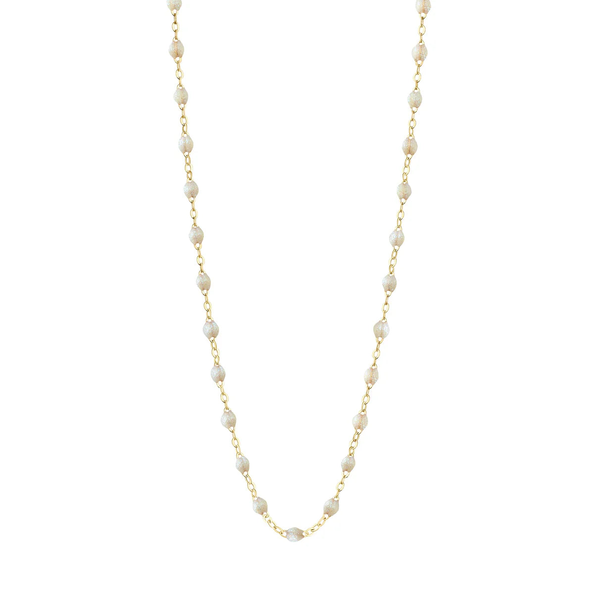 The Gigi Clozeau Classic Gigi Necklace, 16.5", by Gigi Clozeau, is a stunning piece featuring yellow gold with small, white pearls evenly spaced along the chain.