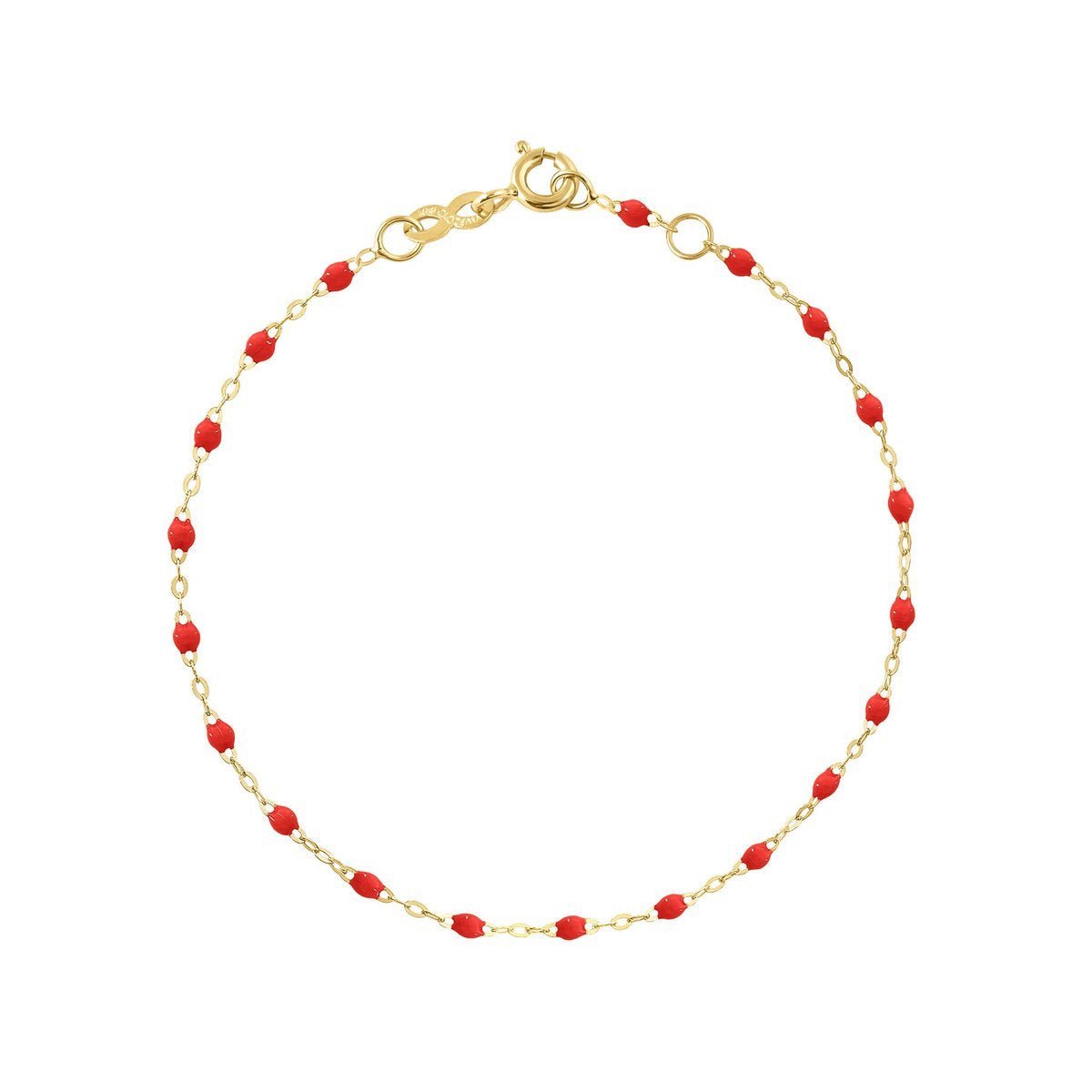 A Gigi Clozeau Classic Gigi Bracelet crafted from 18 carat Yellow Gold with red bead accents and a clasp, named "Poppy," perfect for an everyday look.