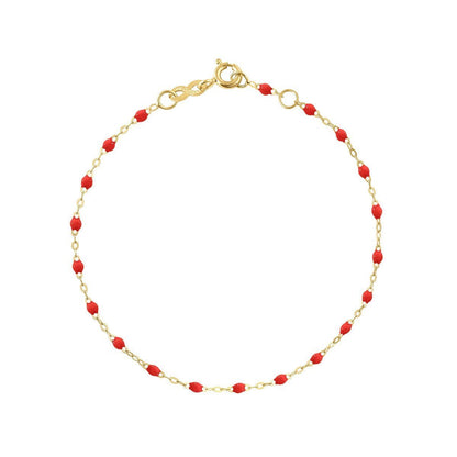 The Classic Gigi Bracelet 6.7" by Gigi Clozeau combines elegance with an 18-carat yellow gold chain and small red beads, finished with a perfect small clasp closure.