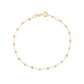 The Gigi Clozeau Classic Gigi Bracelet 6.7" is a delicate 18 carat yellow gold piece with evenly spaced small beads and a round clasp, ideal for easy, everyday elegance.
