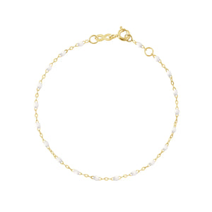 The Classic Gigi Bracelet 6.7" by Gigi Clozeau features small white beads evenly spaced on an 18k yellow gold chain with a lobster clasp, offering a delicate and signature look inspired by Gigi Clozeau's unique jewels.