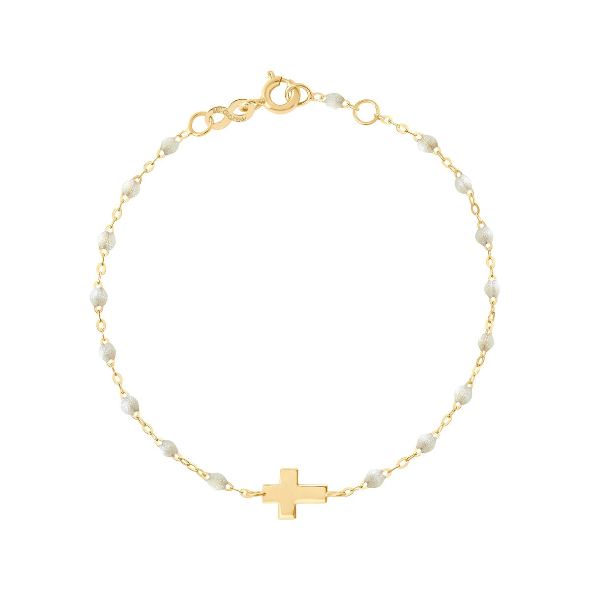 The Gigi Clozeau Classic Cross Charm Bracelet 6.7" features elegant resin pearls, a central cross charm, 18 carat gold craftsmanship, and an adjustable clasp.