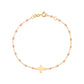 The Gigi Clozeau Classic Cross Charm Bracelet 6.7" is crafted in 18k gold, featuring small pink beads and a central cross charm on a white background.