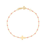 The Gigi Clozeau Classic Cross Charm Bracelet 6.7" is crafted in 18k gold, featuring small pink beads and a central cross charm on a white background.